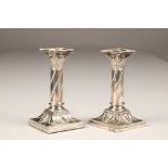 Pair Victorian 'Adam Style' silver candle sticks, raised on square stepped bases, assay marked,