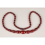 Cherry amber bead necklace, length 67cm, largest bead 25mm, total weight 44g