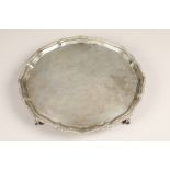 Presentation silver salver, gadrooned pie crust edge, raised on four ball and claw feet, assay