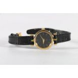 Ladies Gucci wristwatch with Roman numeral chapter ring.