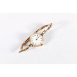 9ct gold cased ladies wristwatch on rolled gold strap.
