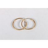 Pair of 9ct gold textured hoop earrings in Jersey Goldsmith box, 1.4g.