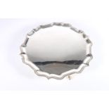 Sterling silver salver with wavy edged rim raised on paw supports, London, 1956, 846g