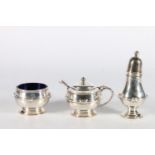 Sterling silver three piece condiment set with blue glass liners, Elkington and Co, Birmingham,