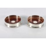 Pair of sterling silver wine coasters with turned wood bases, Goodwins Antiques Ltd, Edinburgh,