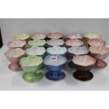 Set of eighteen Maling of Newcastle lustre pottery sundae dishes. (18)