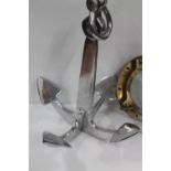 Chromed metal doorstop in the form of a ship's anchor, 52cm tall.