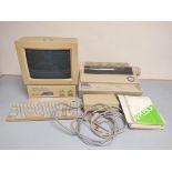 1980s Apple IIGS computer with RGB monitor, 658-4081 keyboard, 3.5 Drive Reader, manuals and an