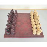 Contemporary composite chess set in the Greco-Roman style.