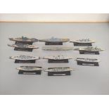 Eleven WW2 collector's model battleships on stands. To include HMS Hood, IJN Yamato, Bismarck, HMS