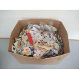 Box containing a huge quantity of mixed world postage stamps