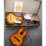 Rambler acoustic guitar with case, another acoustic guitar, a guitar method book and a guitar