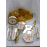 Amber-coloured five-piece glass dressing table set, three-piece brush set, similar tray and a