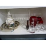 Portuguese-style pottery wall charger, modern Chinese vase and cover, glass decanter, glasses,