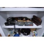 Camera parts, military boxes, antique blowpipe set, pipe, tripod etc (one shelf).
