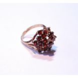 9ct gold garnet lady's cluster ring set with multiple small garnets, 5.3g gross, size M.