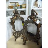 Pair of neo classical-style copper photograph frames on easel supports, decorated with figures and