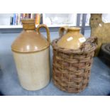 Two stoneware wine flagons, one in original wicker carry basket.  (2)