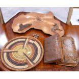 Wall clock modelled as a map of Africa, two snakeskin clutch bags and a wicker wall hanging modelled