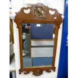 George II style mahogany scroll wall mirror.