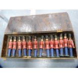 Set of thirteen painted wooden soldiers contained in a fitted wooden box.