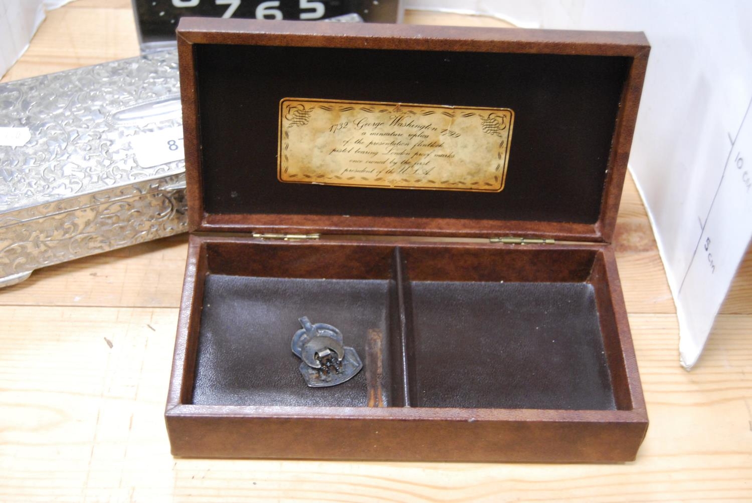 Cigarette case with moulded percussion pistol to the top, white metal jewellery casket and a - Image 3 of 3