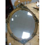 Gilt ornate wall mirror.