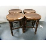Set of four stools with saddle seats.  (4)