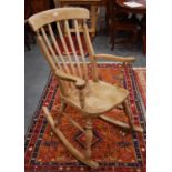 Victorian-style stained pine rocking chair.