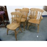 Set of five pine spindle-back chairs and a similar carver chair.  (6)