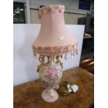 Floral pottery table lamp and shade.