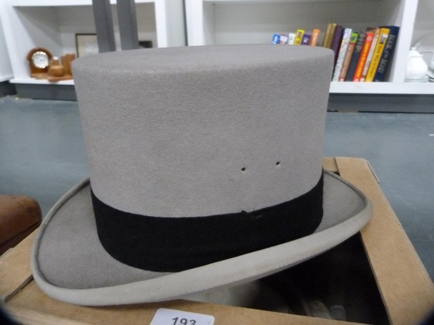 Top hat retailed by Lock & Co., St James' Street, London with cardboard hat box.