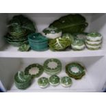 Portuguese-style cabbage and leaf decorated table wares to include plates, ashets, sauce tureens etc