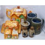 Westminster four-piece tea set modelled as cottages comprising a teapot, butter dish with cover,