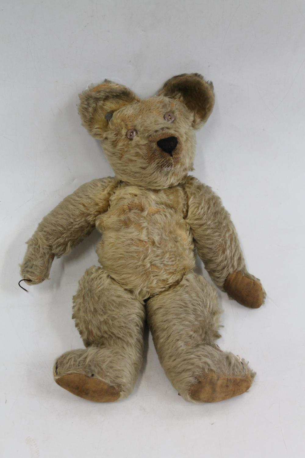 Early Steiff style button ear teddy bear, mohair with articulate limbs and hunch back, 46cm long.