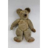 Early Steiff style button ear teddy bear, mohair with articulate limbs and hunch back, 46cm long.