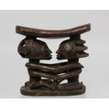 African tribal DRC Luba-Shankadi headrest with double caryatid base of two embracing figures, 18.5cm