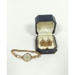 Lady's Peerex 9ct gold watch on v.g. bracelet and a pair of cinquefoil earrings, each with a