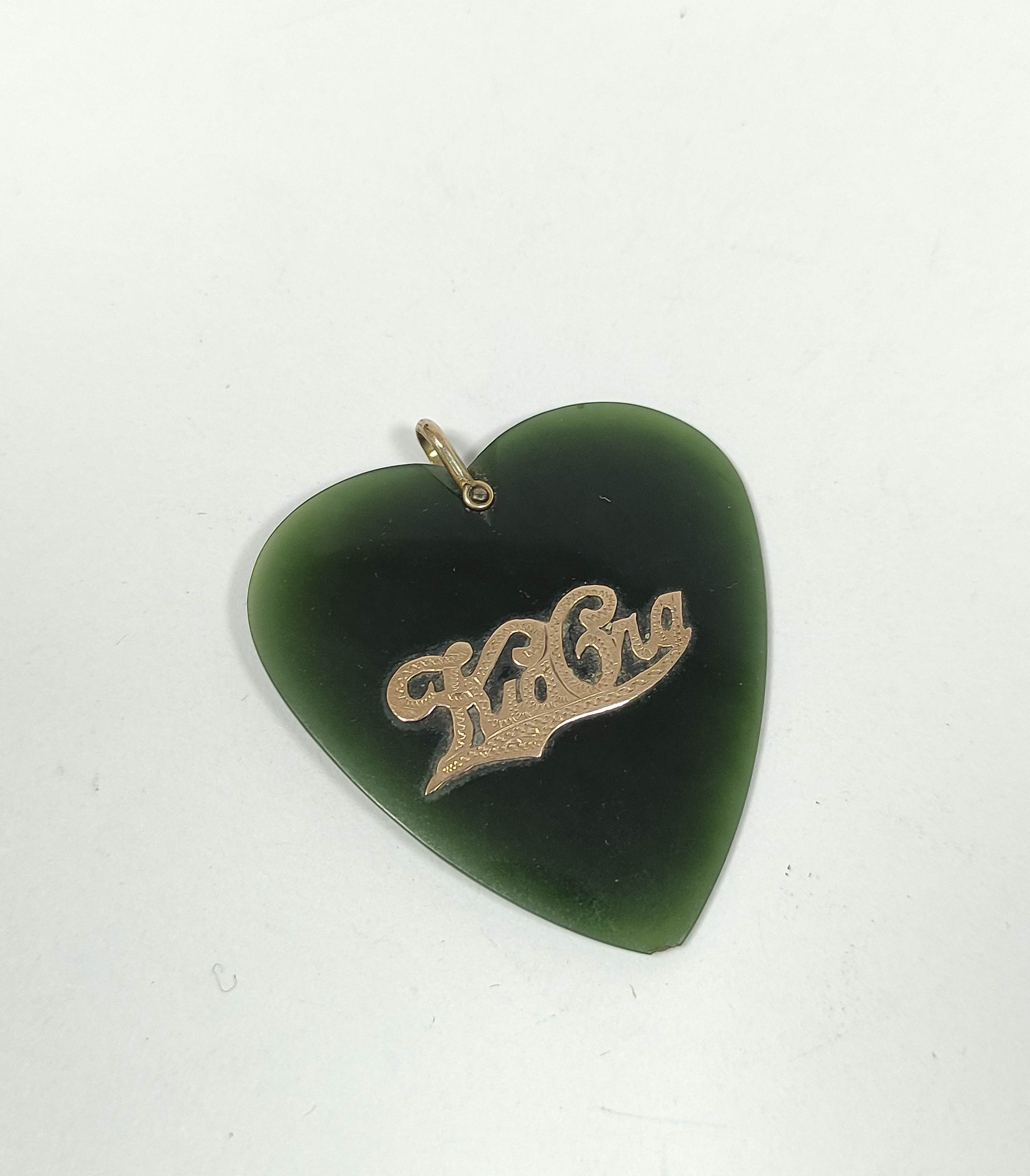 New Zealand greenstone heart pendant with gold pierced 'Kia Ora' and loop '9ct' approx. 45mm x 41mm.