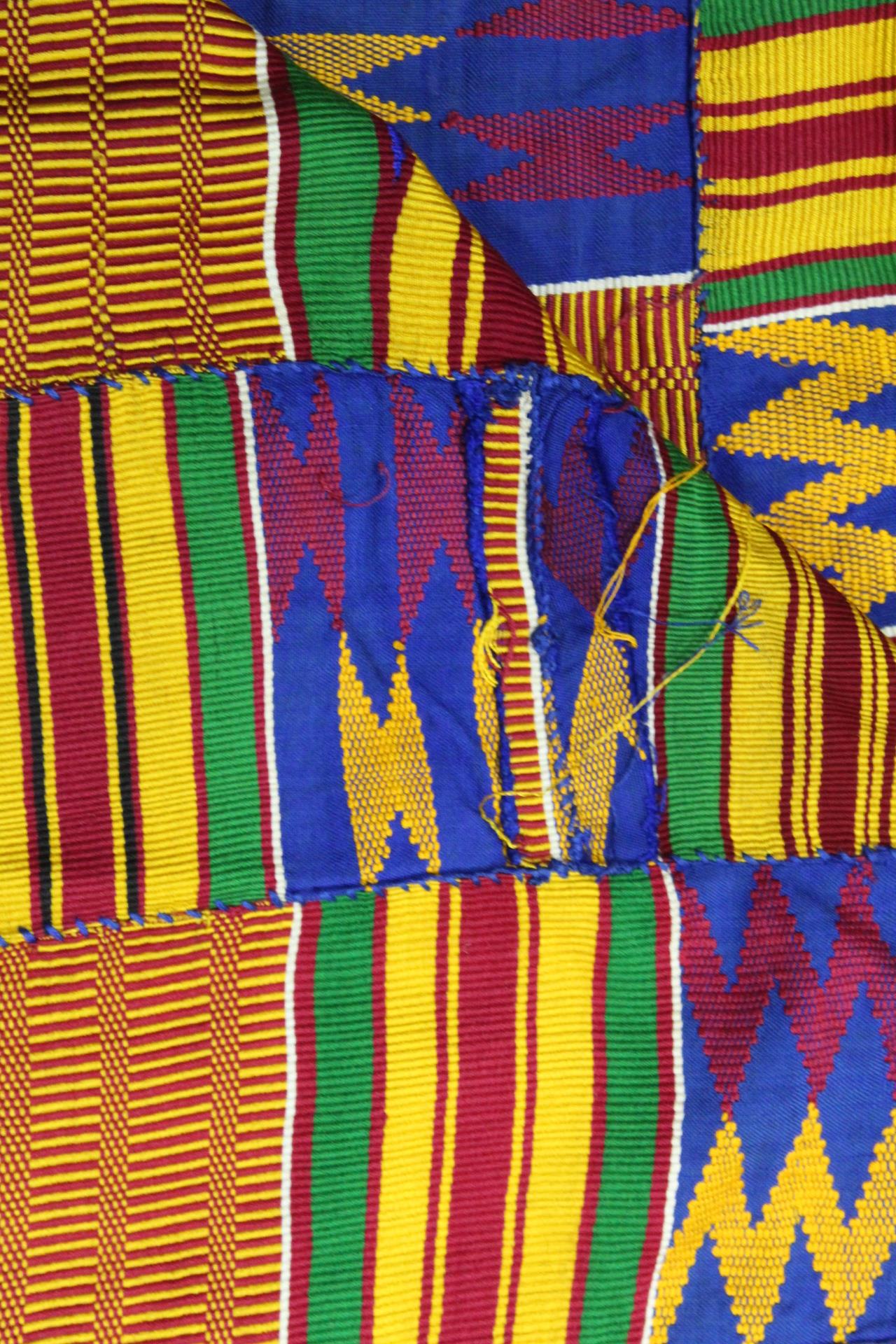 African Asanti Kente cloth in woven silk and cotton fabrics in predominantly blue, yellow, green and - Image 10 of 11