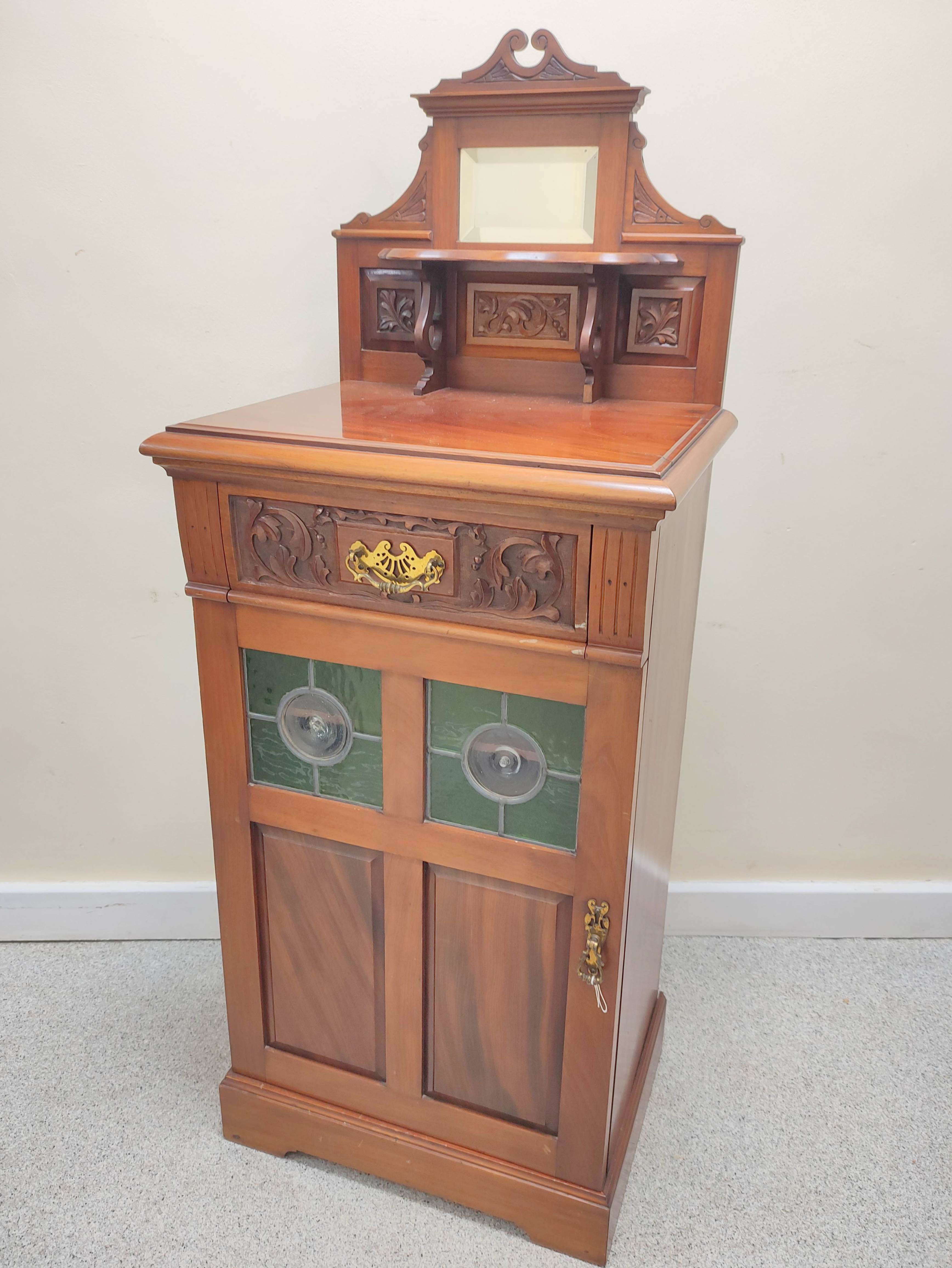 Edwardian mahogany music cabinet with mirrored pediment above a single drawer and door inset with