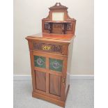 Edwardian mahogany music cabinet with mirrored pediment above a single drawer and door inset with