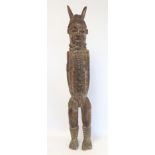 Large African carved Nigerian wooden figure of a Benin warrior or Oba, 52cm high.
