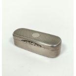 Silver snuff box, rectangular with rounded ends, engine turned all over with chased thumb piece,