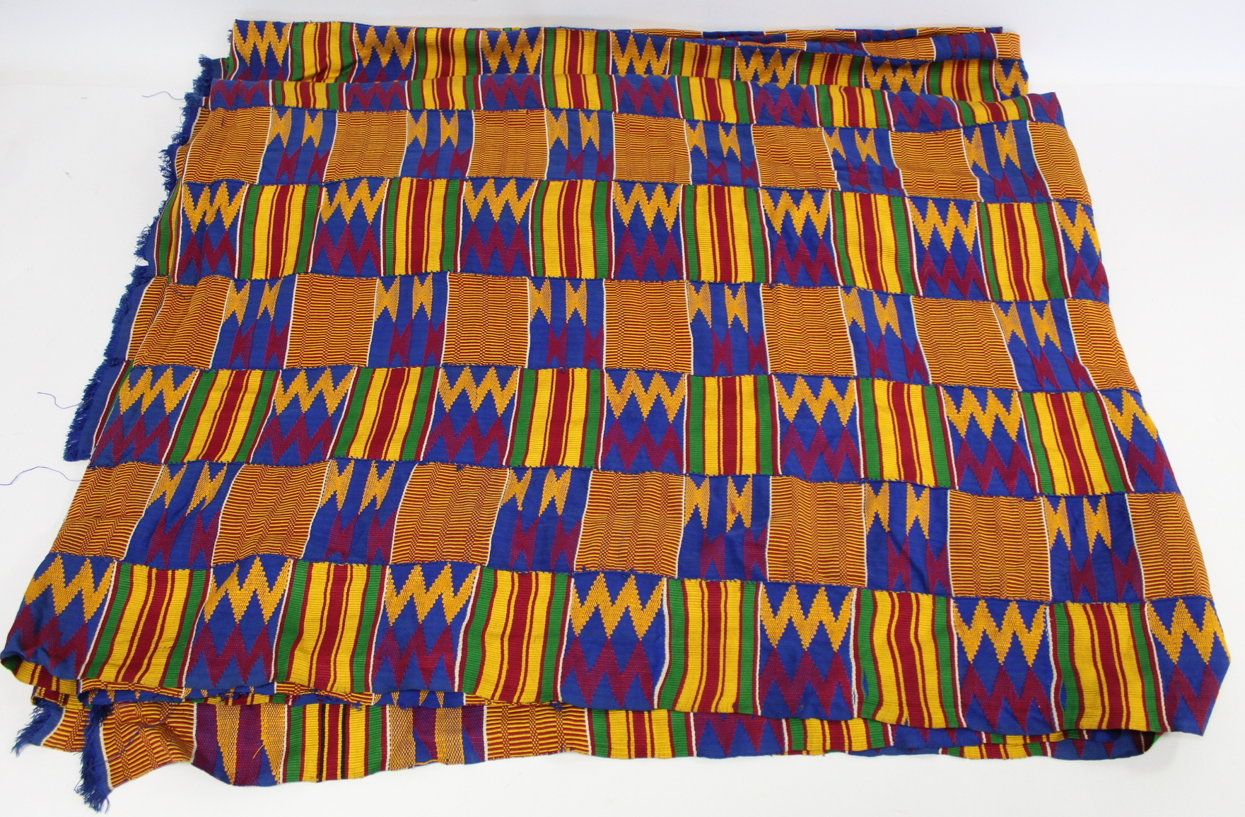 African Asanti Kente cloth in woven silk and cotton fabrics in predominantly blue, yellow, green and