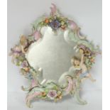 20thC German Meissen porcelain style dressing table mirror, the shaped scroll frame surmounted by