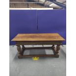 17th century style oak refectory table, the rectangular plank top above carved frieze, fitted with a