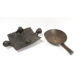 African carved hardwood divination dish of rectangular form with twin mask head handles,