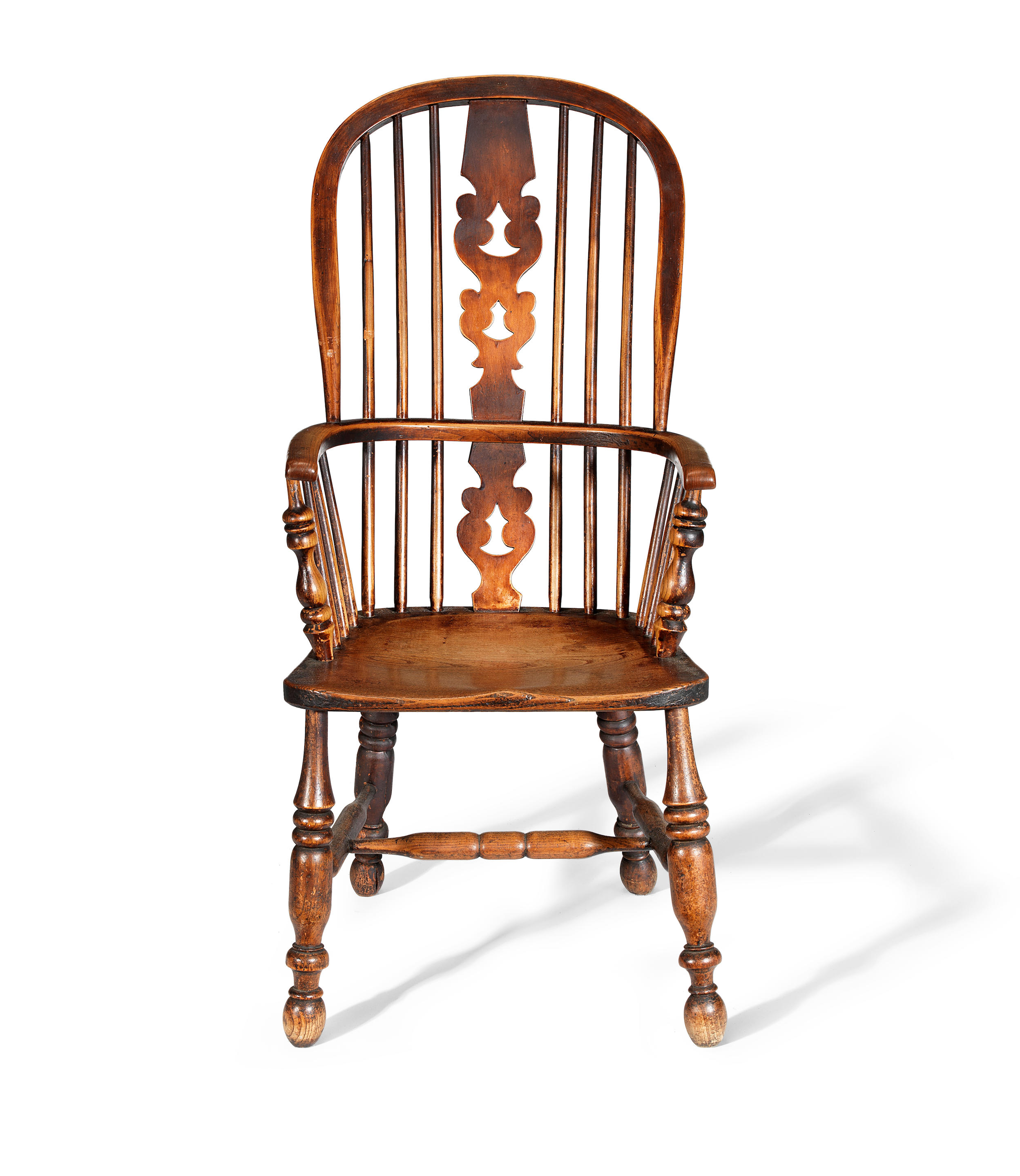 Ash and elm Windsor armchair, the hoop frame with spindle back and pierced splat, raised on turned