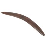 Antique hardwood boomerang of plain curved form, 65cm long, some damages.